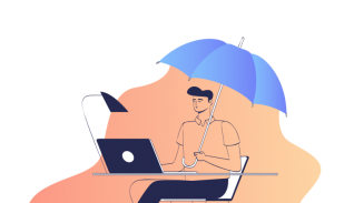 A man working on his desk covered with an umbrella